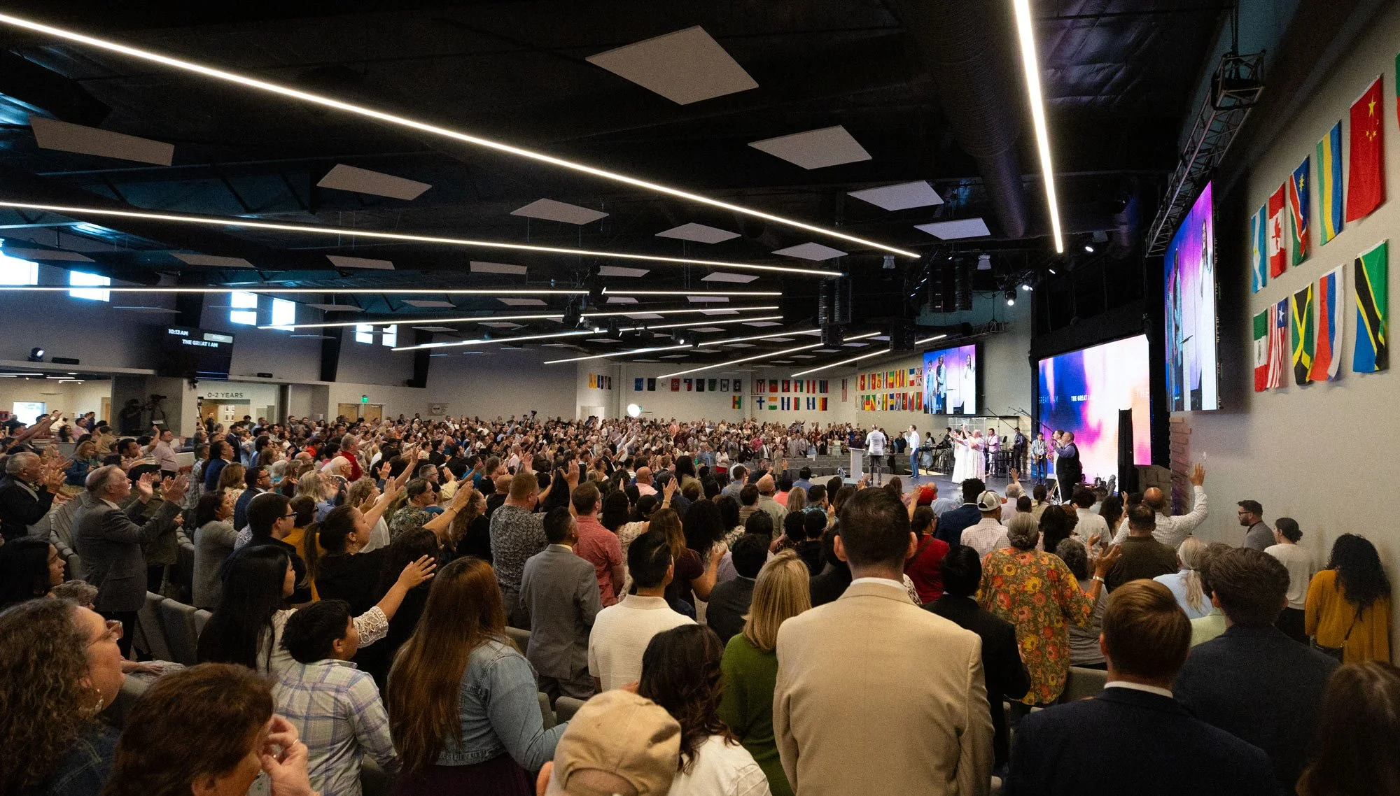 Door Church Service. People worshiping in bright room.
