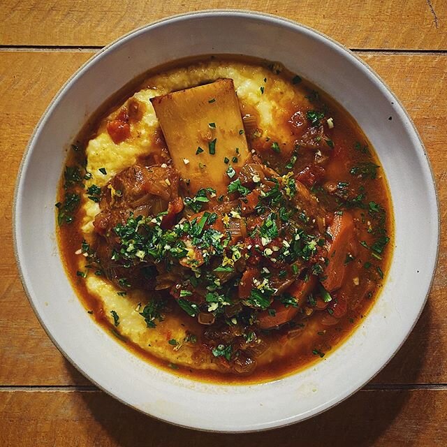 Osso buco&mdash;a Milanese specialty of cross-cut veal shanks braised in veggies, wine, and broth&mdash;with an orange zest gremolata, over sous vide (!) polenta. I&rsquo;d never made this with actual veal shanks before and was v nervous about messin