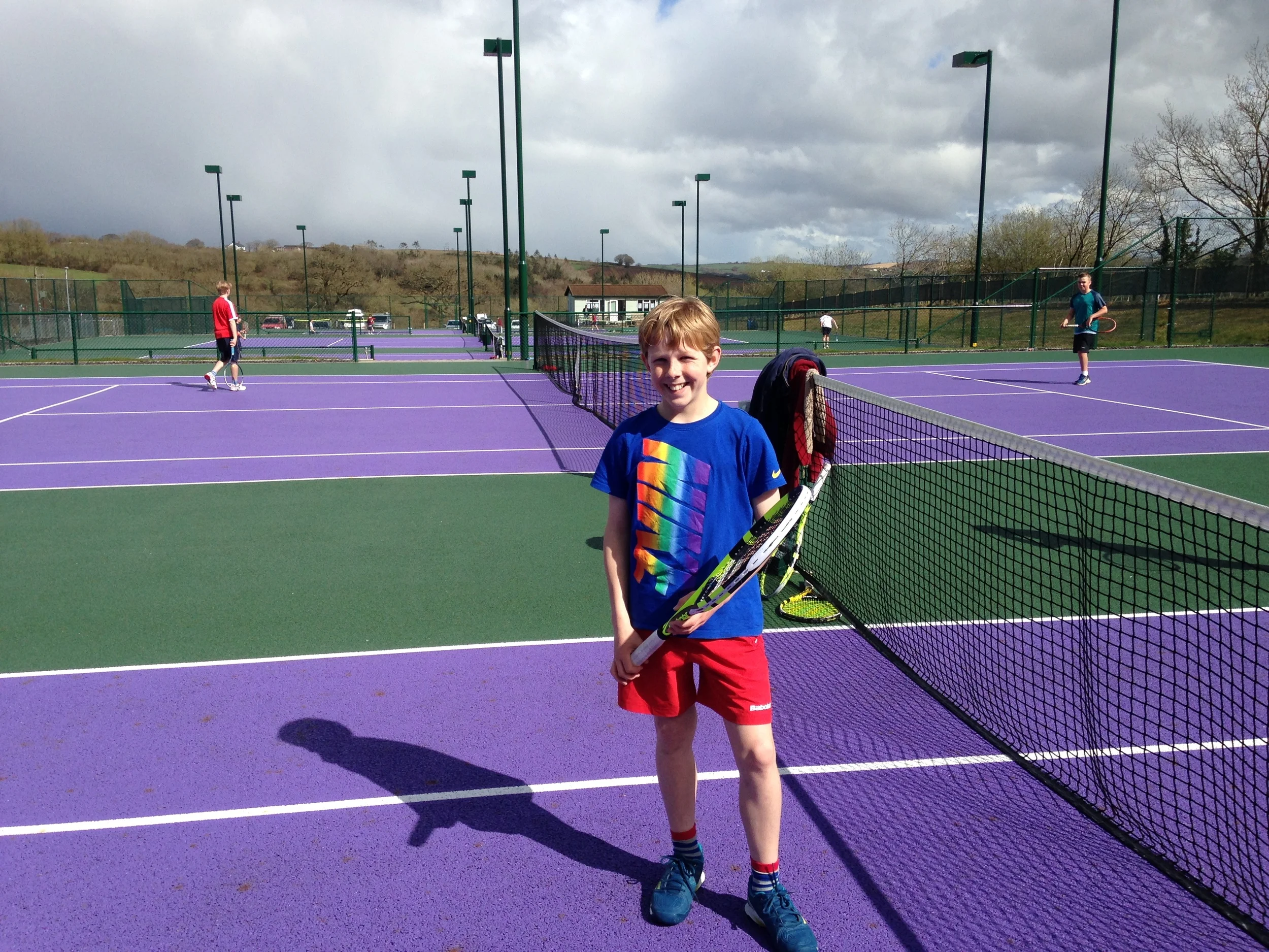 Triumphant Alex at the end of his 6 hour tennisathon!
