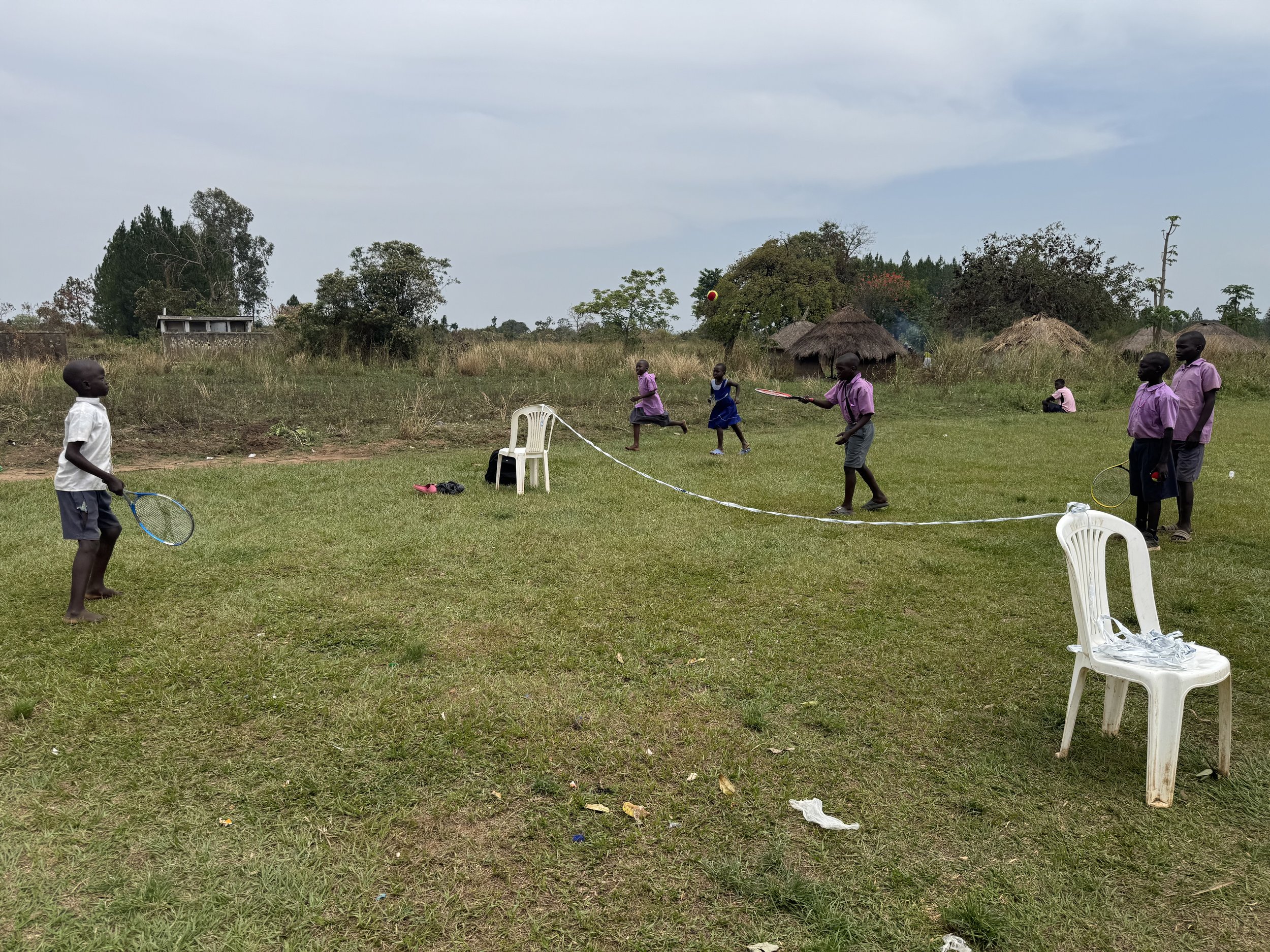 Children from Uganda enjoying a Game of Tennis using racquets from Atlantic Racquet Centre