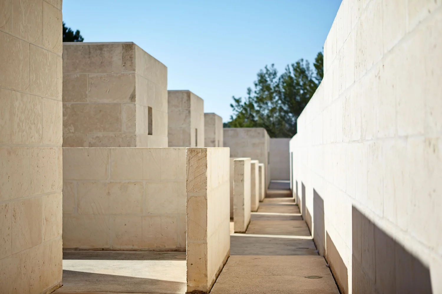 Walkway between the stone walls and courtyards of Casa Tagomago.