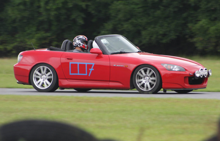 The author on track at his first track day. Instructor Khoi Nguyen riding shotgun. Check out those rally lights!
