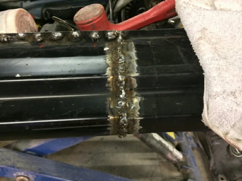 a grinder will make those boogers go away, just make sure the weld is penetrated well 