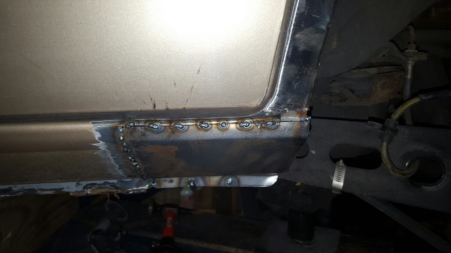 cut the rust. Hand form new piece. Make piece fit well. Zap piece in. Flapwheel/grind the weld down. 