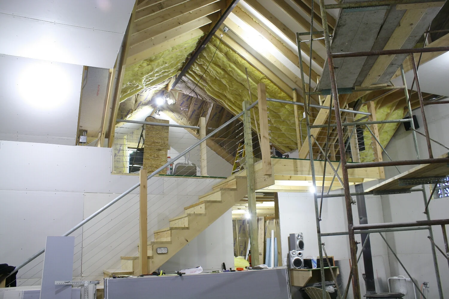 Part-way through insulating and drywalling. Foam was placed against the exterior with a slight airgap on the roof to vent the heat build up, then expanding foam'd in place. R19 insulation was applied behind the foam, then the drywall installed. 