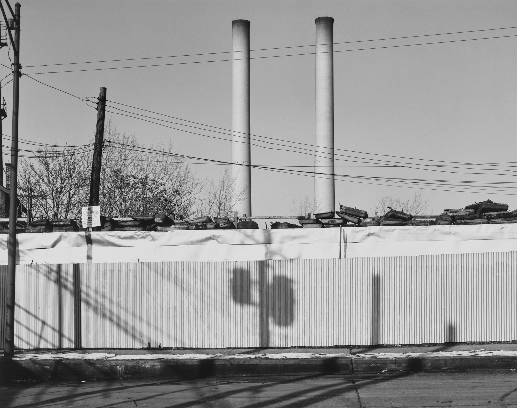 © Nicholas G Merrick 1976, Junkyard Wall and Smokestacks, Chicago, Illinois.jpeg