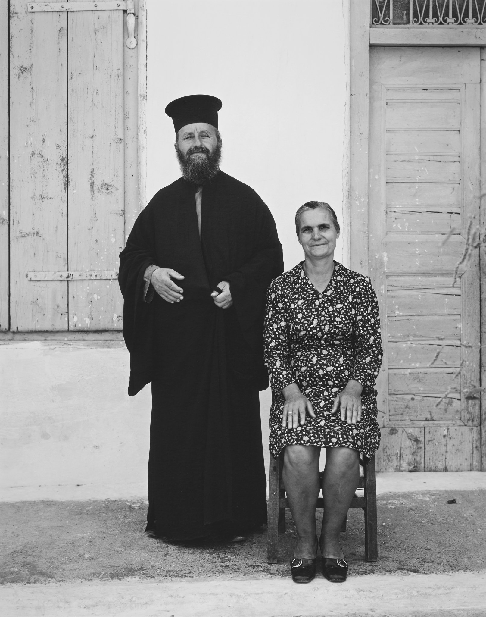 Erateini Portfolio Georgios Facalos priest with wife 1974 © Nick Merrick.jpg