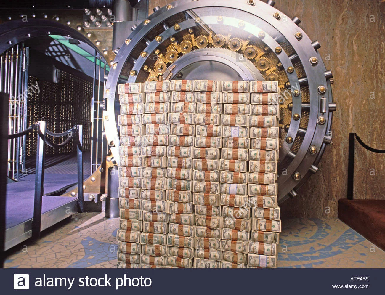 money-stacked-in-front-of-a-bank-vault-ATE4B5.jpg
