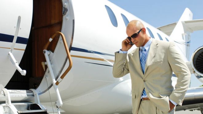 airplane-private-jet-businessman-phone.jpg