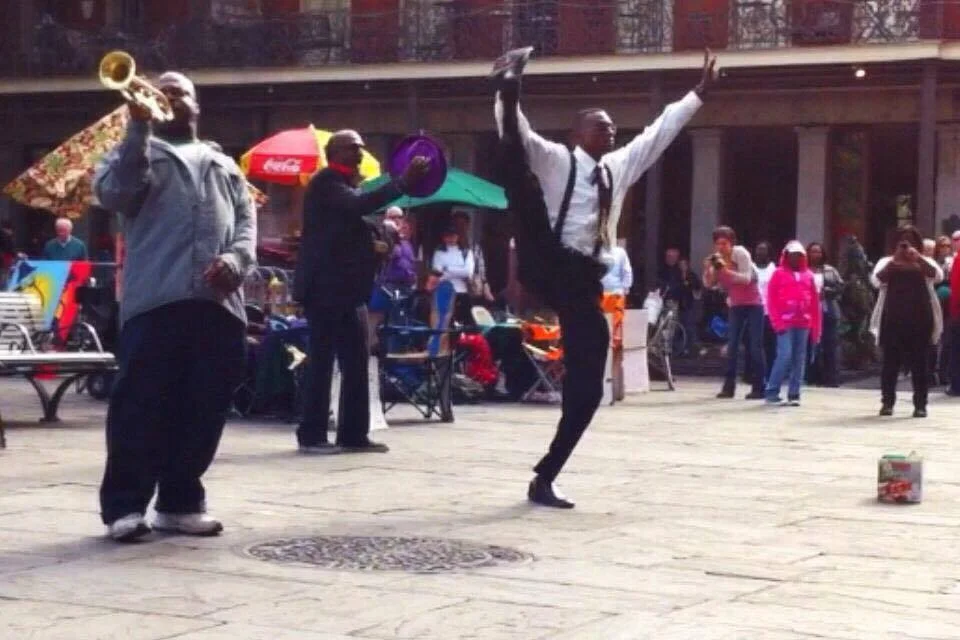 TrizCom Public Relations - men dancing in the street