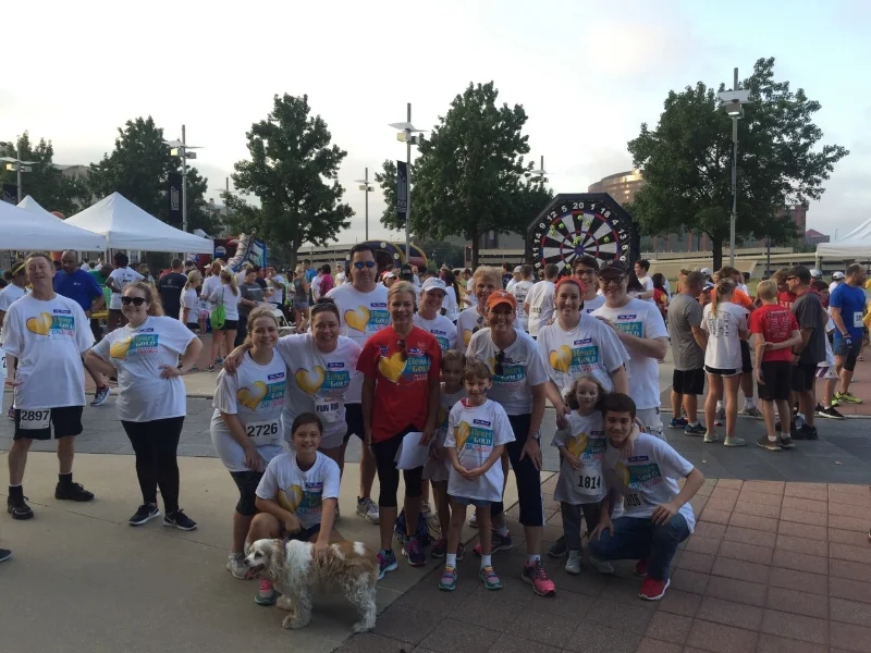 Team TrizCom, pictured here with Heroes for Children’s Co-founder Larissa Linton (in red)