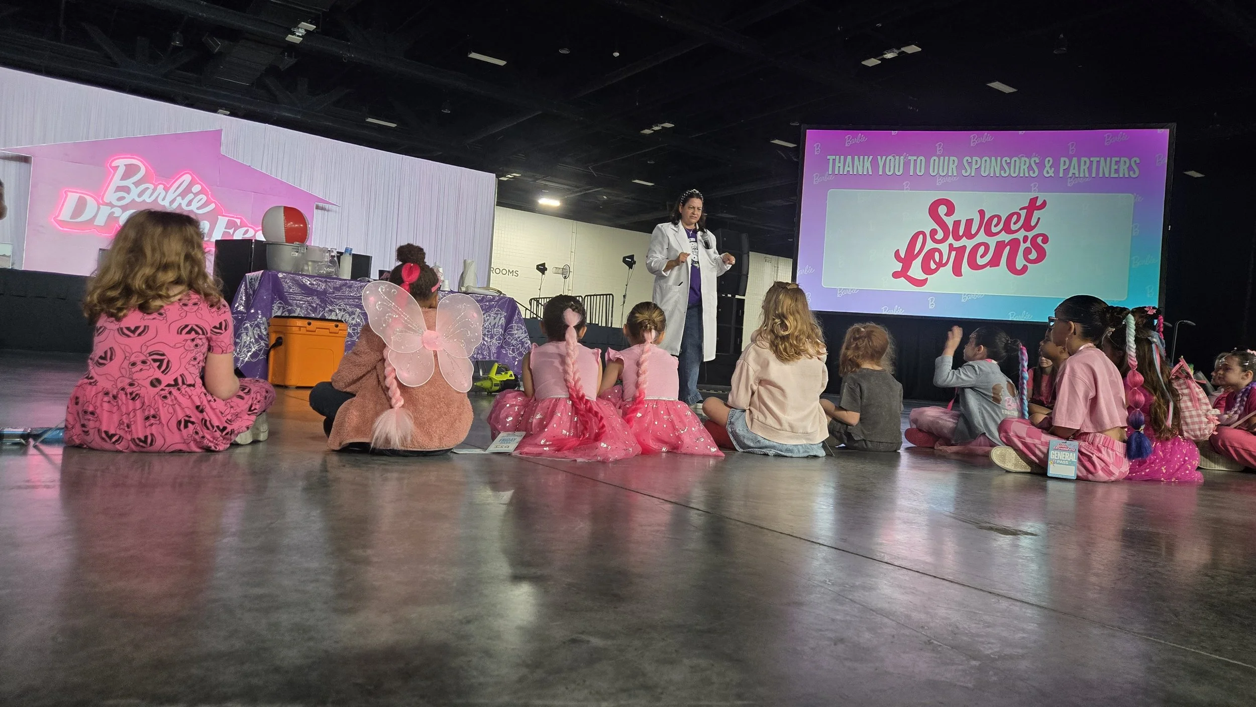 Group of young girls participating in Mad Science programming at Barbie Dream Fest. (C) LightDarkDolls
