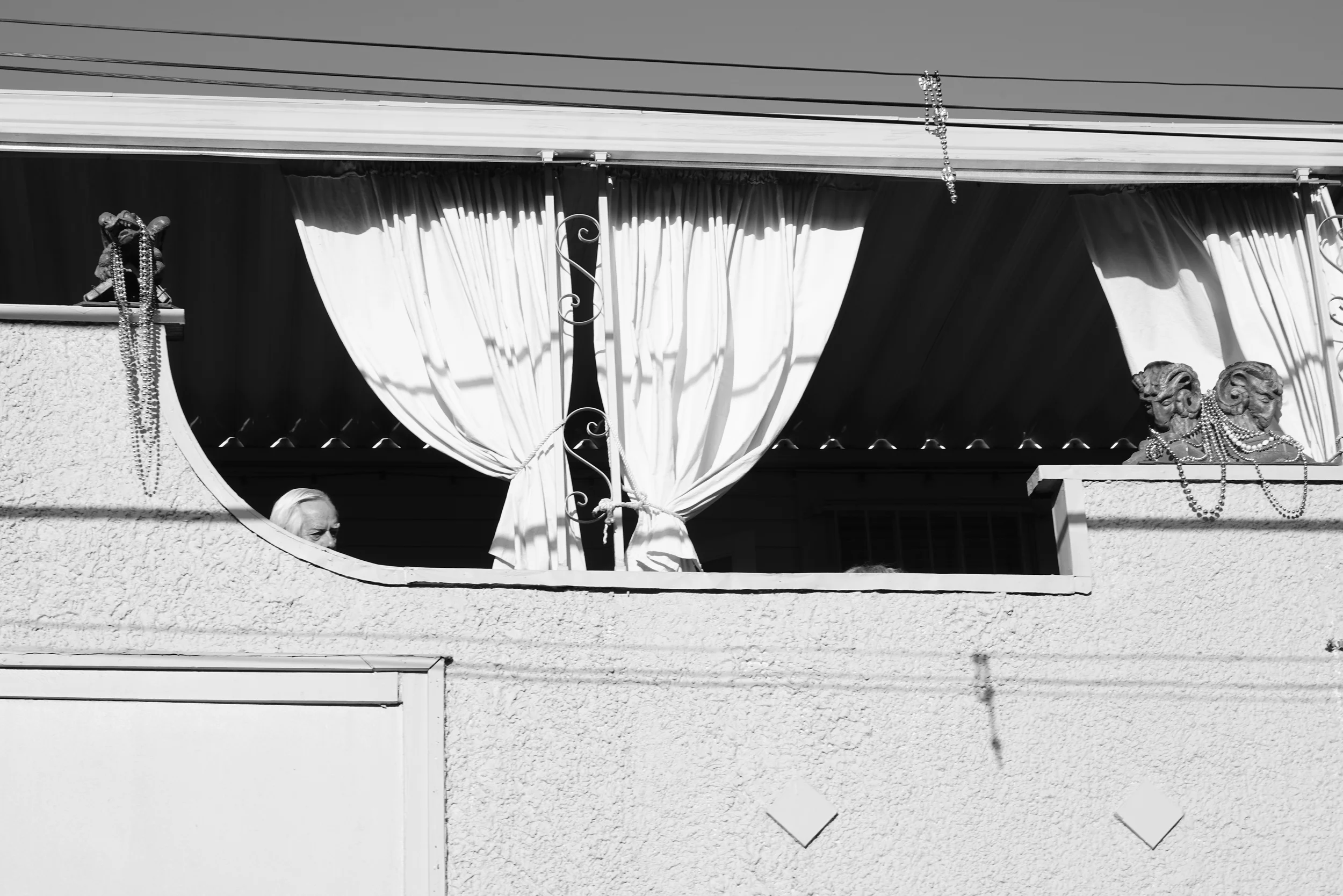 A man looking down, New Orleans 2014