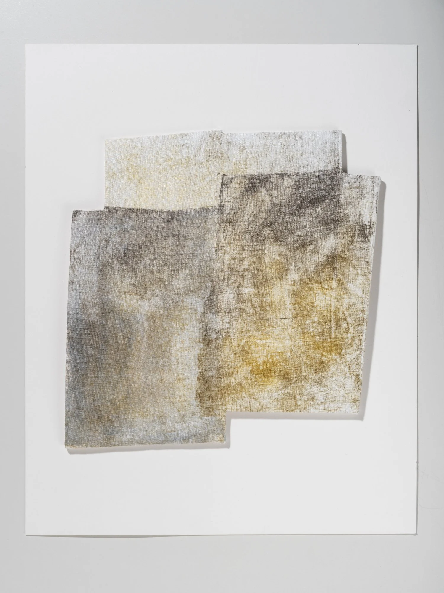 Three overlapping fabric samples with textured patterns in shades of white, beige, and brown on a white background
