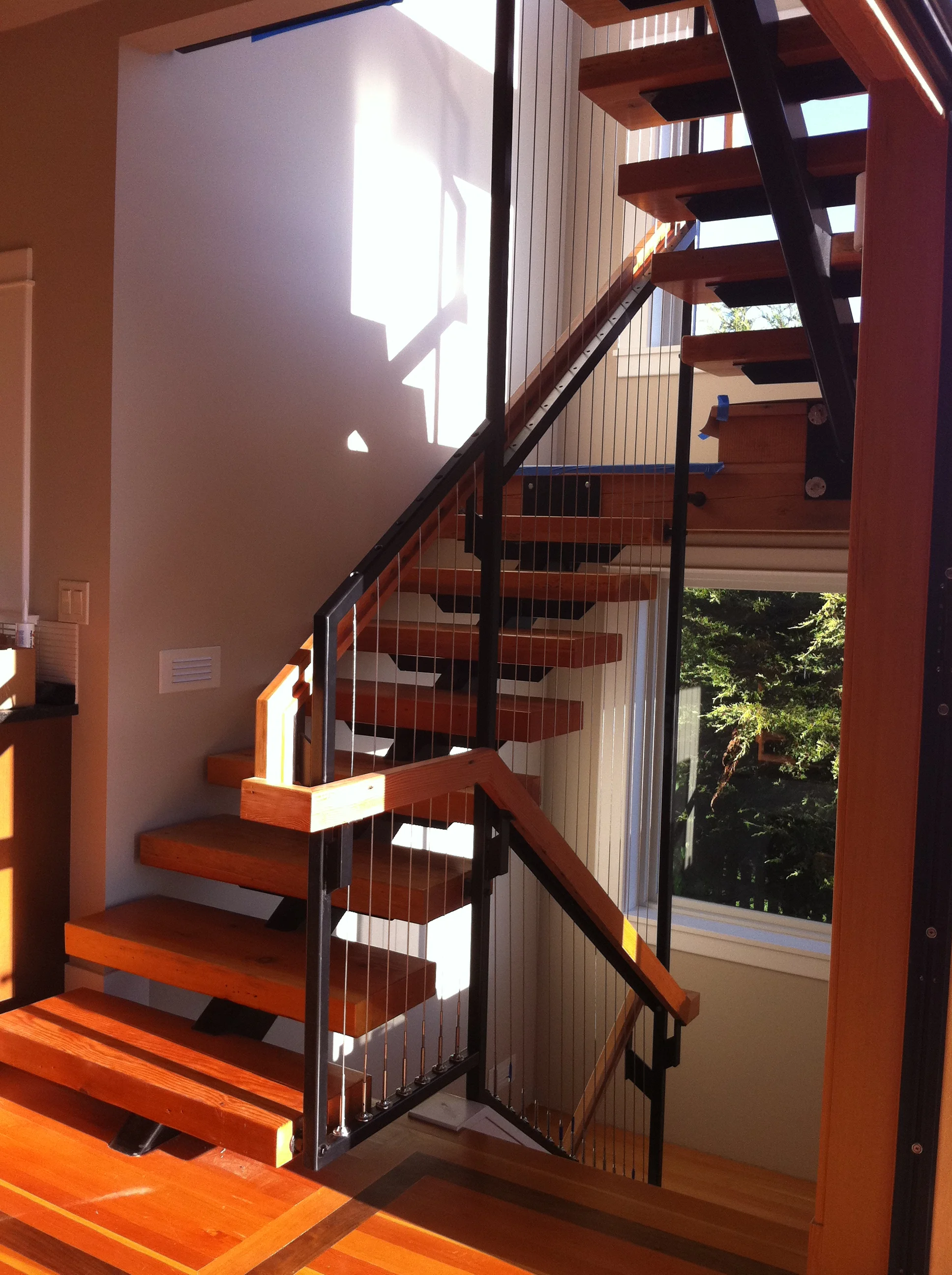 Steel stair stringers with "floating" treads.