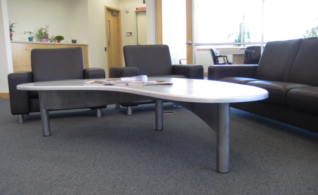 Aluminum coffee table with tinted clear coat.