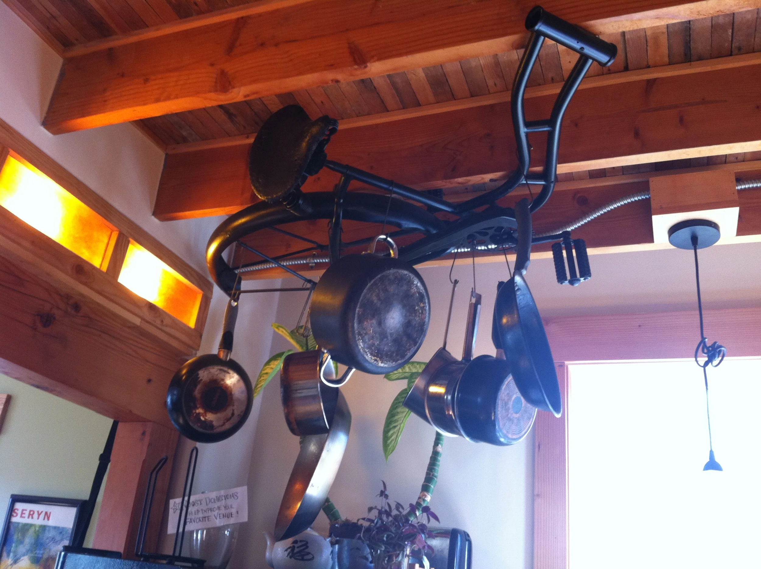 Antique bike frame pot and pan rack.