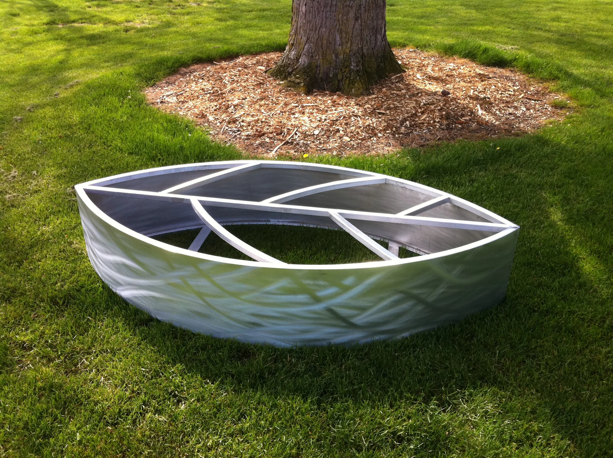 Brushed aluminum leaf planter.