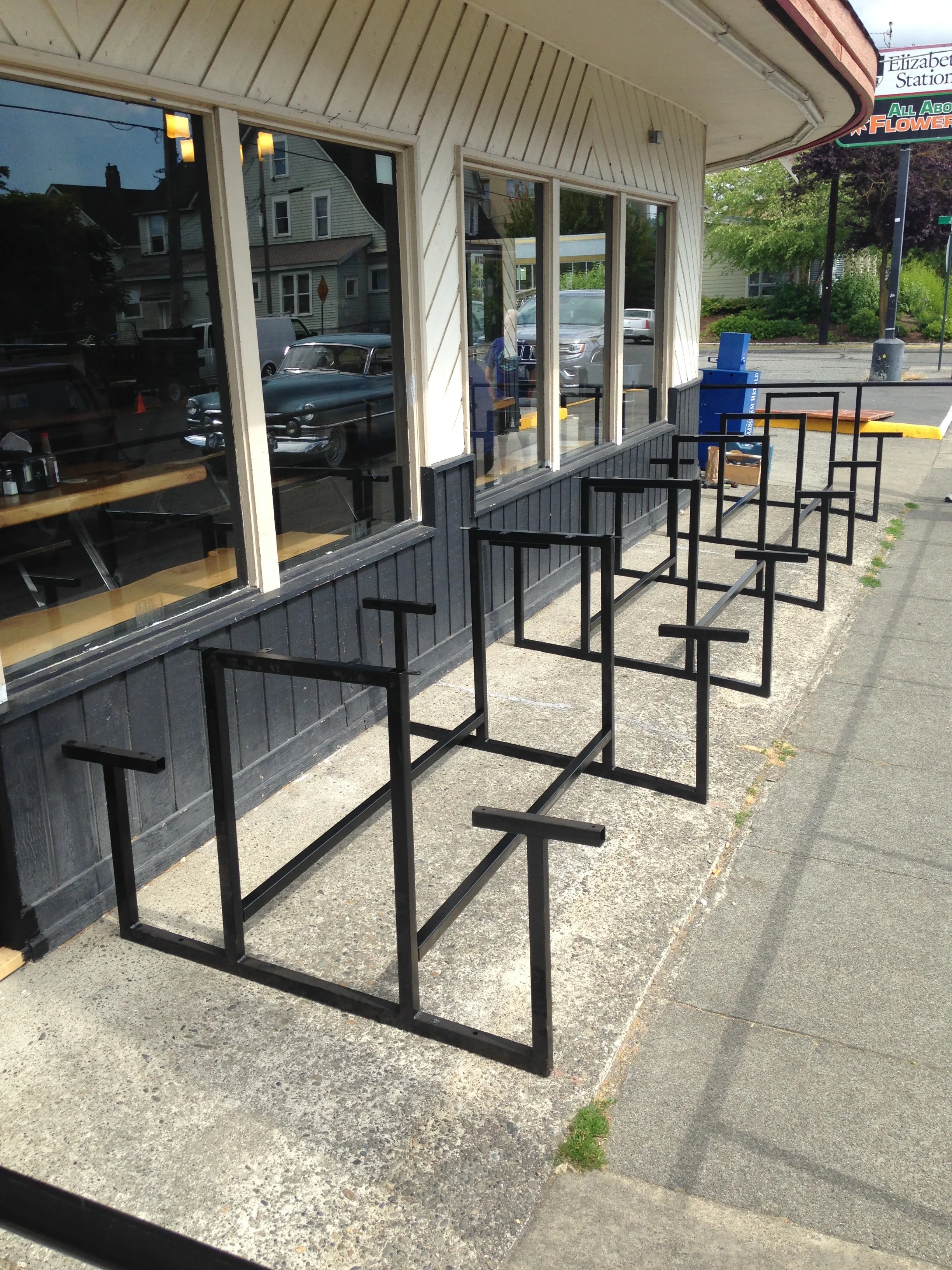 Steel bench frames with individually sloped bases to accomodate uneven ground.