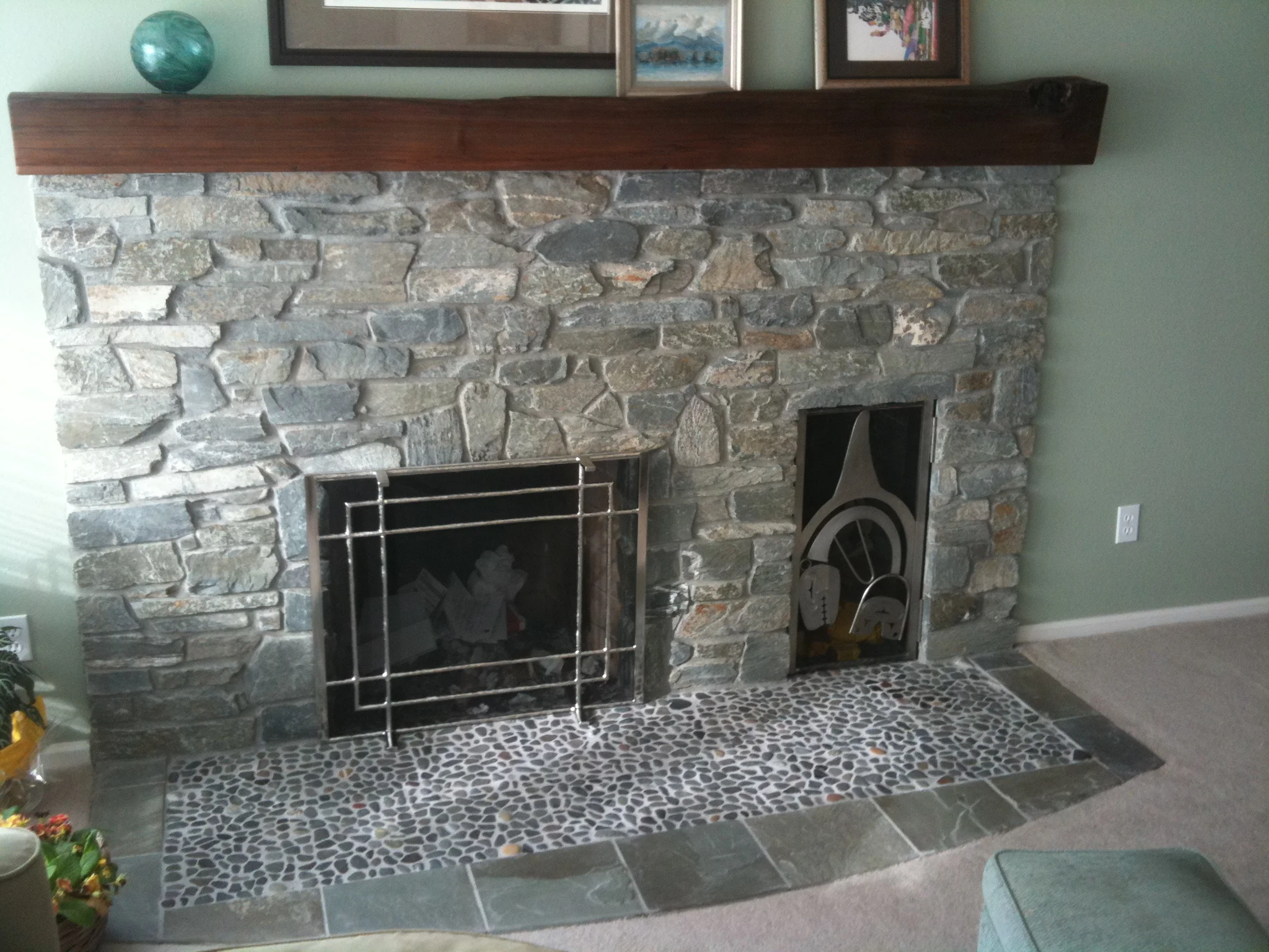 Hand hammered stainless fireplace screen.