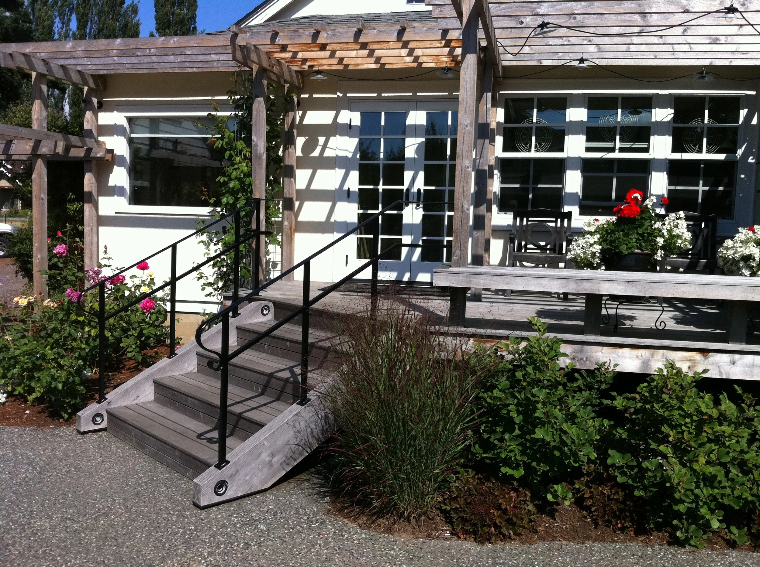 Custom railing with child height lower grab rail design.