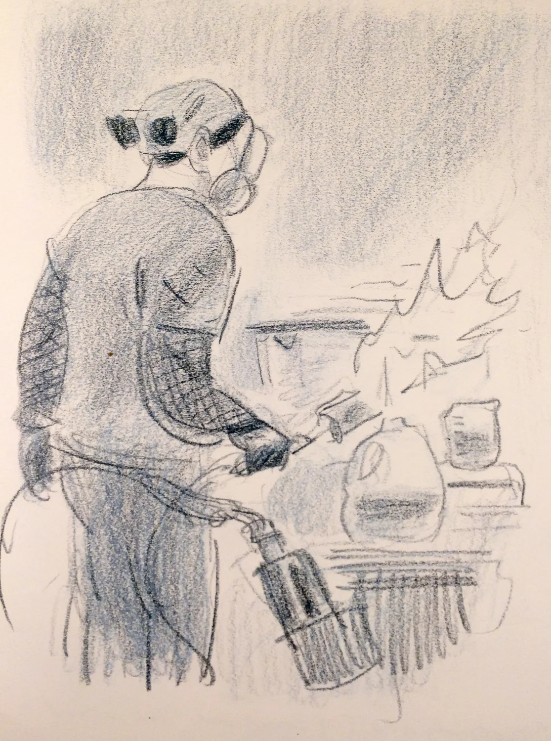 Nagmay torches a panel before applying the patina. 