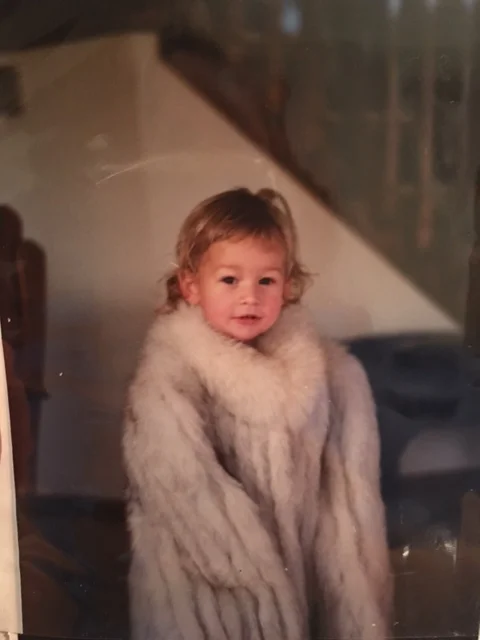 Cute AF in that fur coat right? Also, those bangs. 