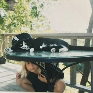 With my favorite cat, Whitesox. Rest in Peace little homie. 