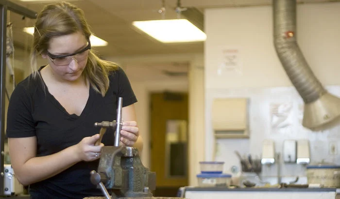 Making a ring in the metals studio at KU. Again, just killing it with the eye wear. 