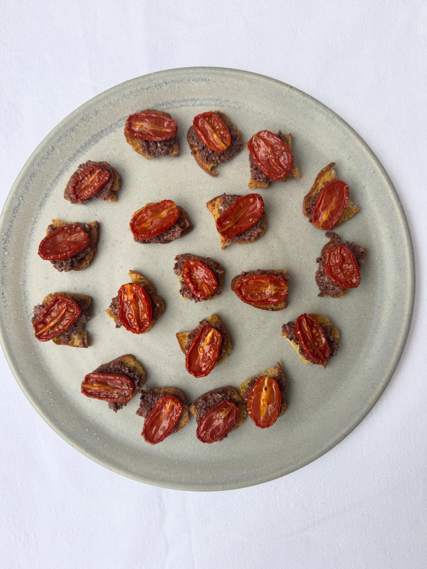 Datterini tomato toasts with leccino olive tapenade for @pol_roger, serving their champagne and our softs with canap&eacute;s again this year. Plenty of everything for 120 guests, including my favourite baked, stuffed mussels with breadcrumbs, parsle