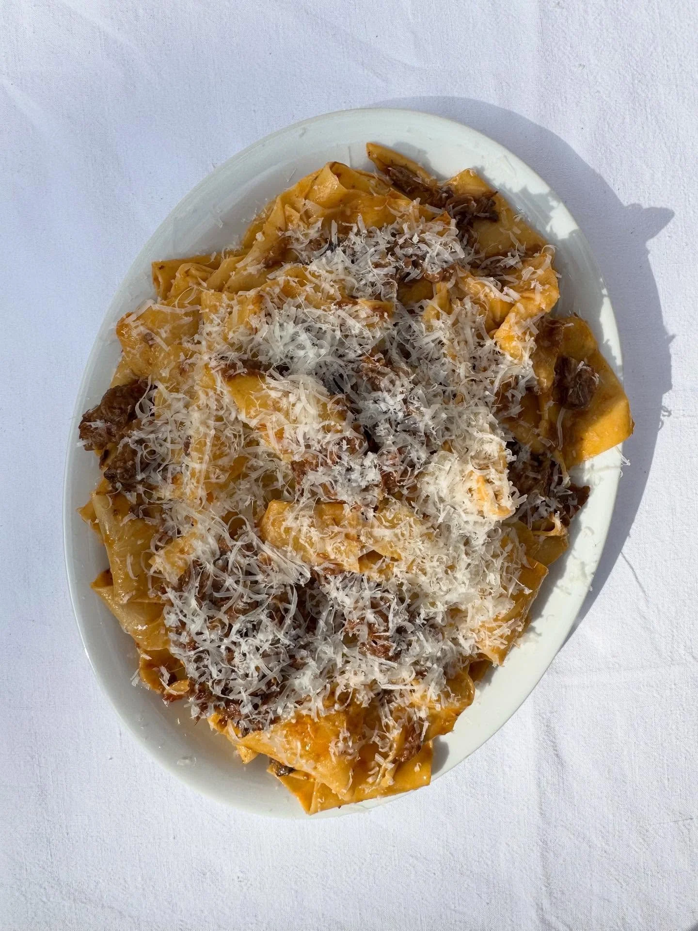 Sharing pasta course of pappardelle, Belted Galloway beef shin ragu and pecorino for Hannah and Richard and their 90 guests, with ricotta ravioli, walnut brown butter and parmesan for the vegetarians. Pictured too are canap&eacute;s of beef battuta c