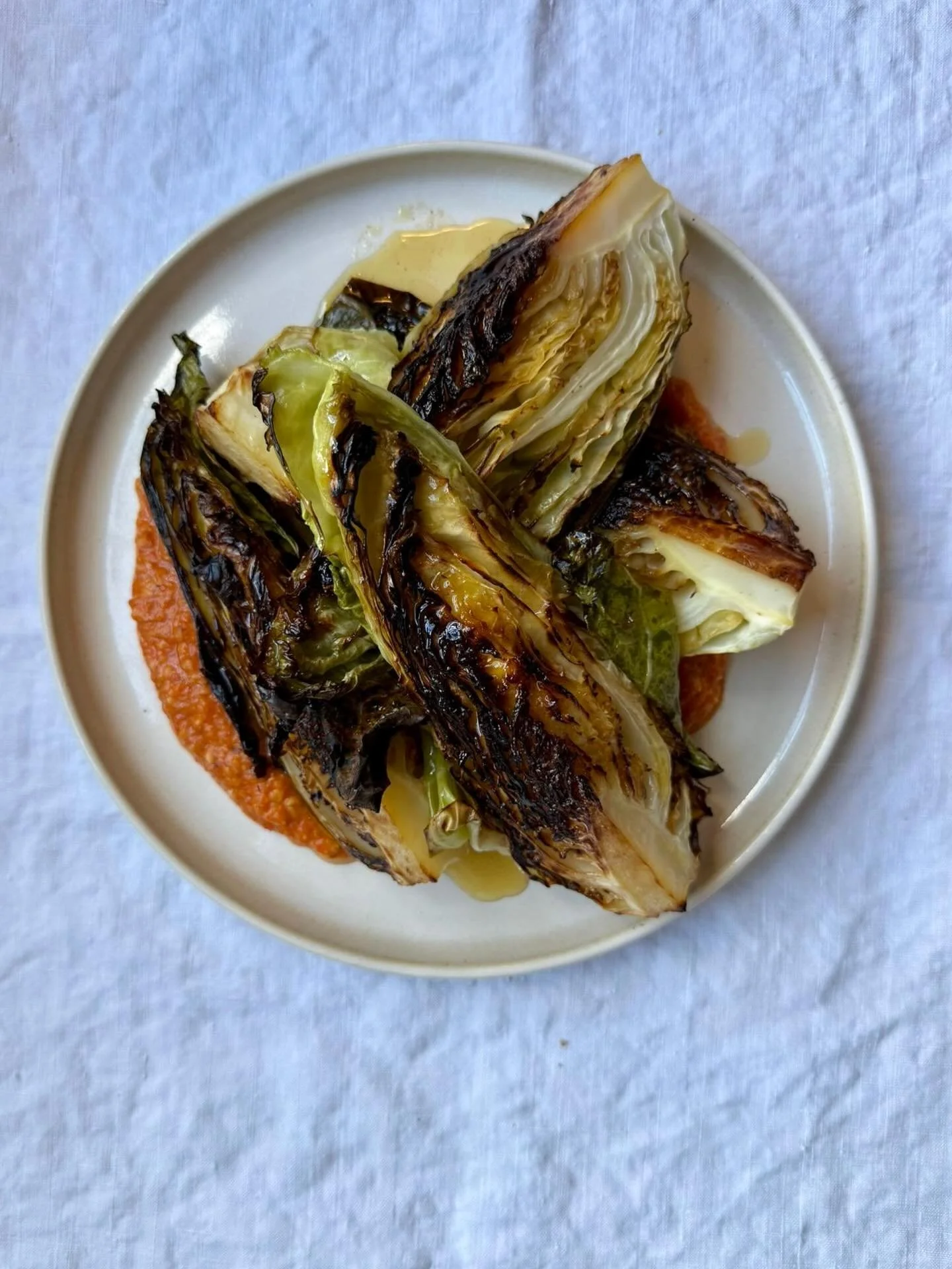 Roasted hispi cabbage and romesco for Laura and Craig as one of their sides. The couple had their ceremony onsite @theforgebristol before their seated meal. Canap&eacute;s of devilled Cornish crab, Italian fennel sausage rolls with apple and prune ke