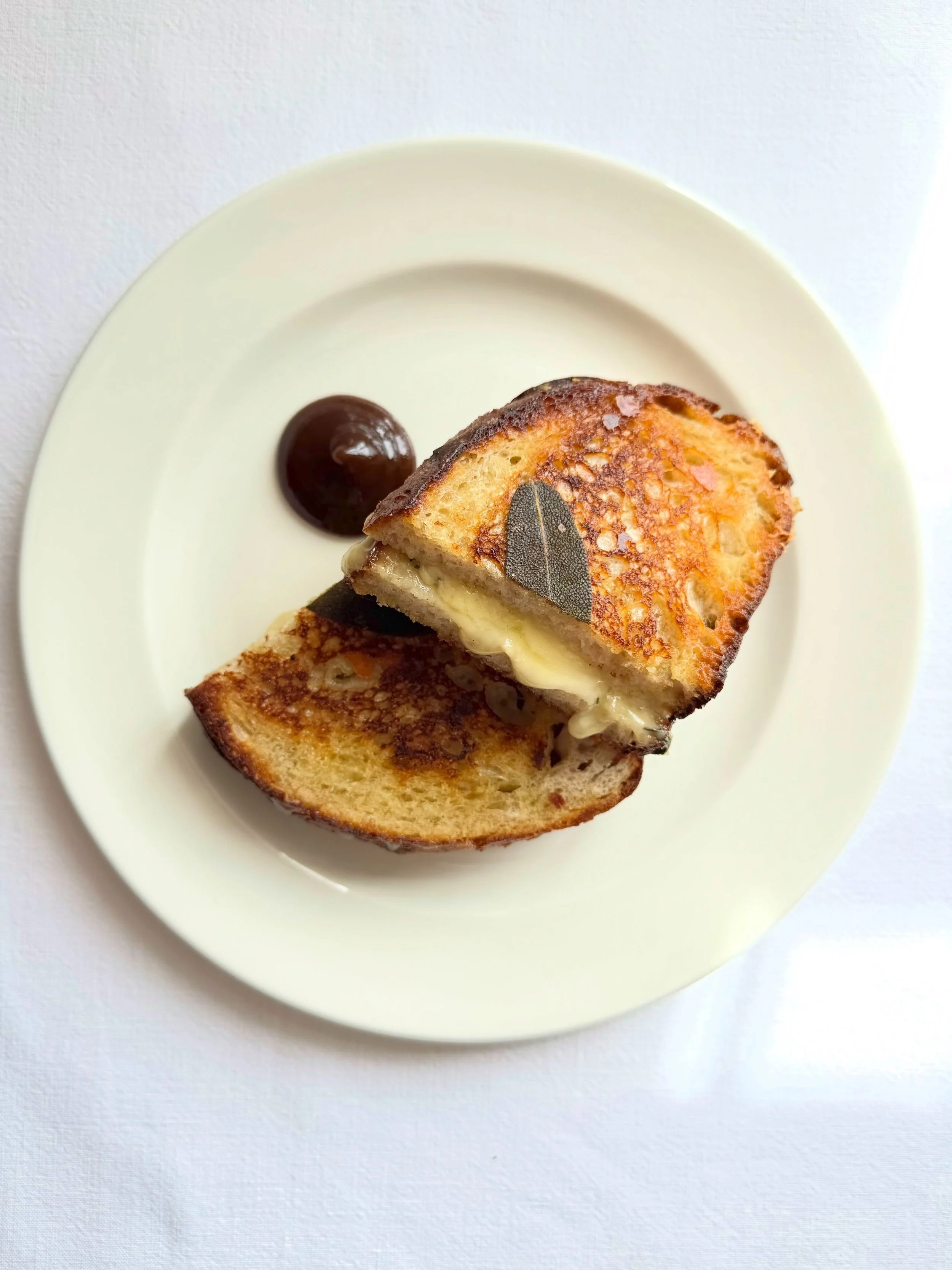 Feast your eyes 👀 🧀 @nanonaltd taleggio, @westcombe cheddar and sage toasties made using @thebristolloaf sourdough. We add spring onions and mustard in to the mix to make it that little bit EXTRA and serve it with our house apple and prune ketchup 