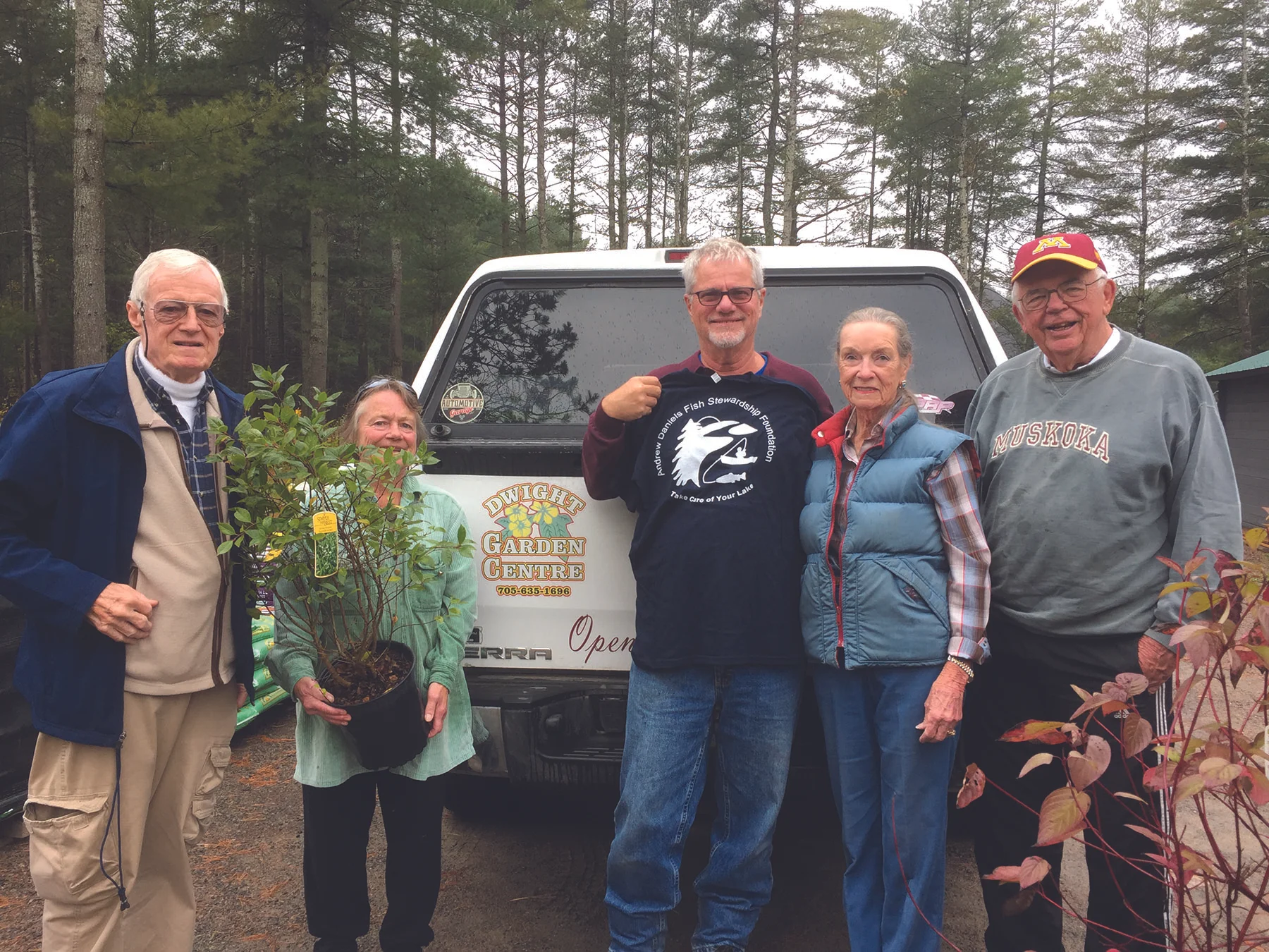 George Daniels, Daphne Curtis, Dennis Rolland, Cathy Nystrom and Andy Montgomery obtaining native plants from Dwight Garden Centre.
