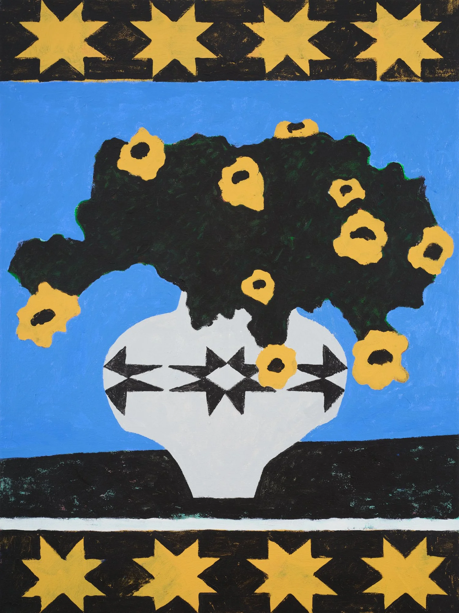 A VASE WITH FLOWERS ON A DARK TABLETOP AGAINST A BLUE BACKGROUND BORDERED BY BLACK AND YELLOW QUILT PATTERNS