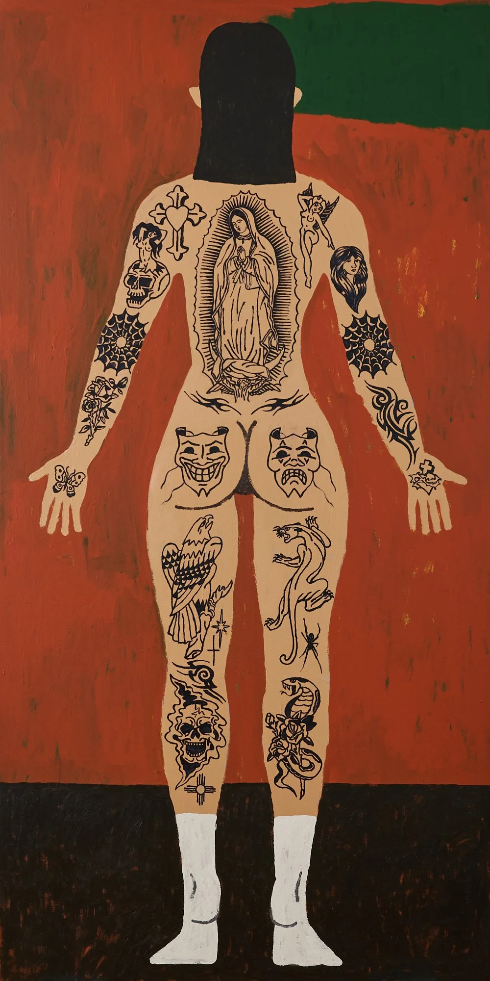 BACK VIEW OF A STANDING WOMAN WITH TATTOO DESIGNS INCLUDING THE VIRGIN MARY