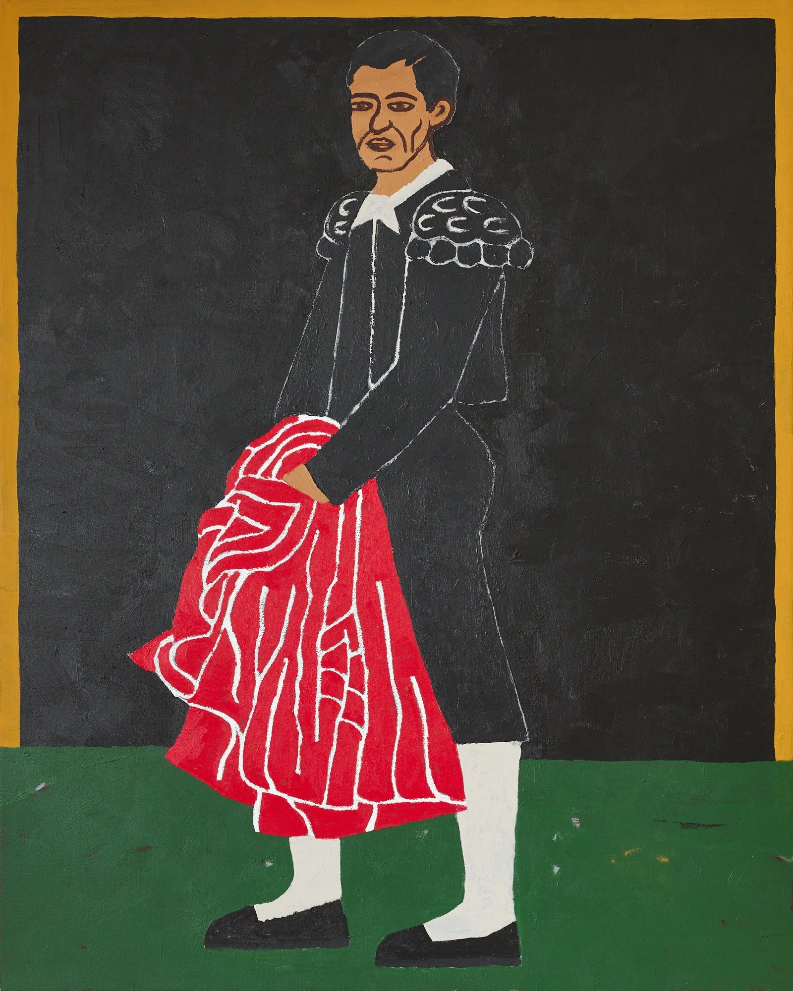 A PORTRAIT OF THE LEGENDARY BULLFIGHTER JUAN BELMONTE GARCIA STANDING AGAINST A BLACK BACKGROUND HOLDING HIS RED MULETA