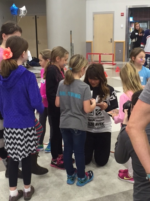 Britney White signs autographs for participants