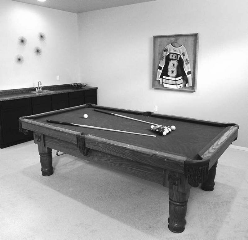 The basement is fully finished with a games room, a wet bar and an extra room that could serve as a bedroom or computer room.