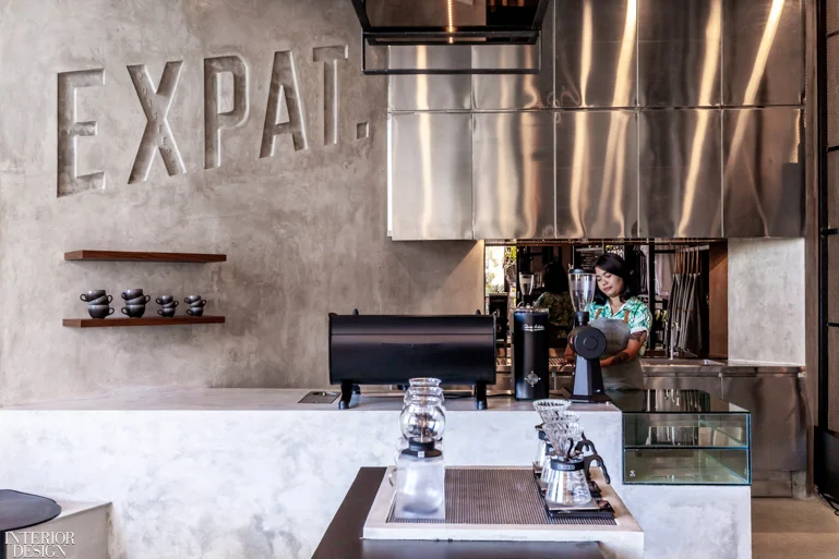 A hand-poured concrete performance counter flows into the concrete walls. Photography by Bali Interiors (Sheila Man).