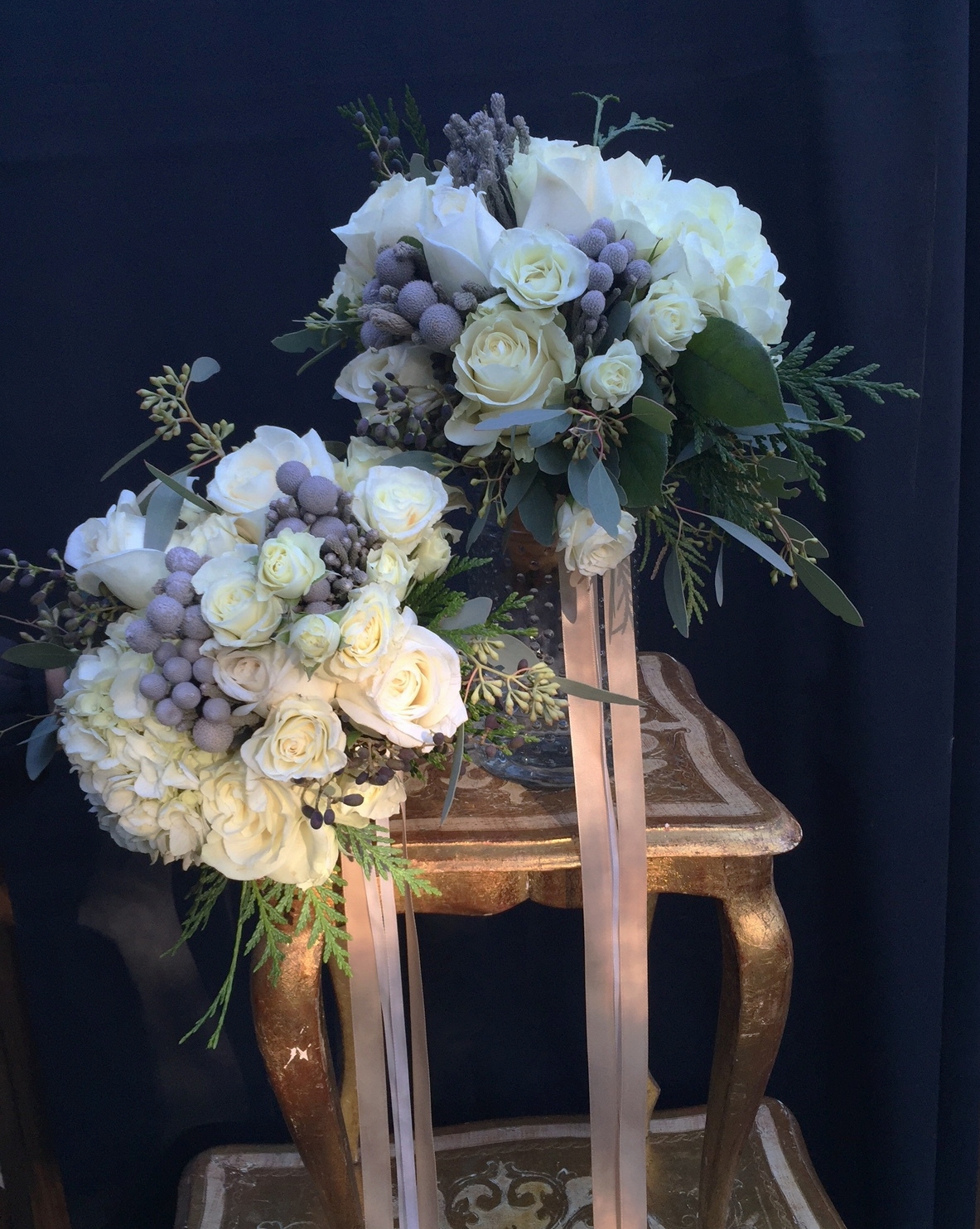 White bridesmaid bouquets with pale gold streamers