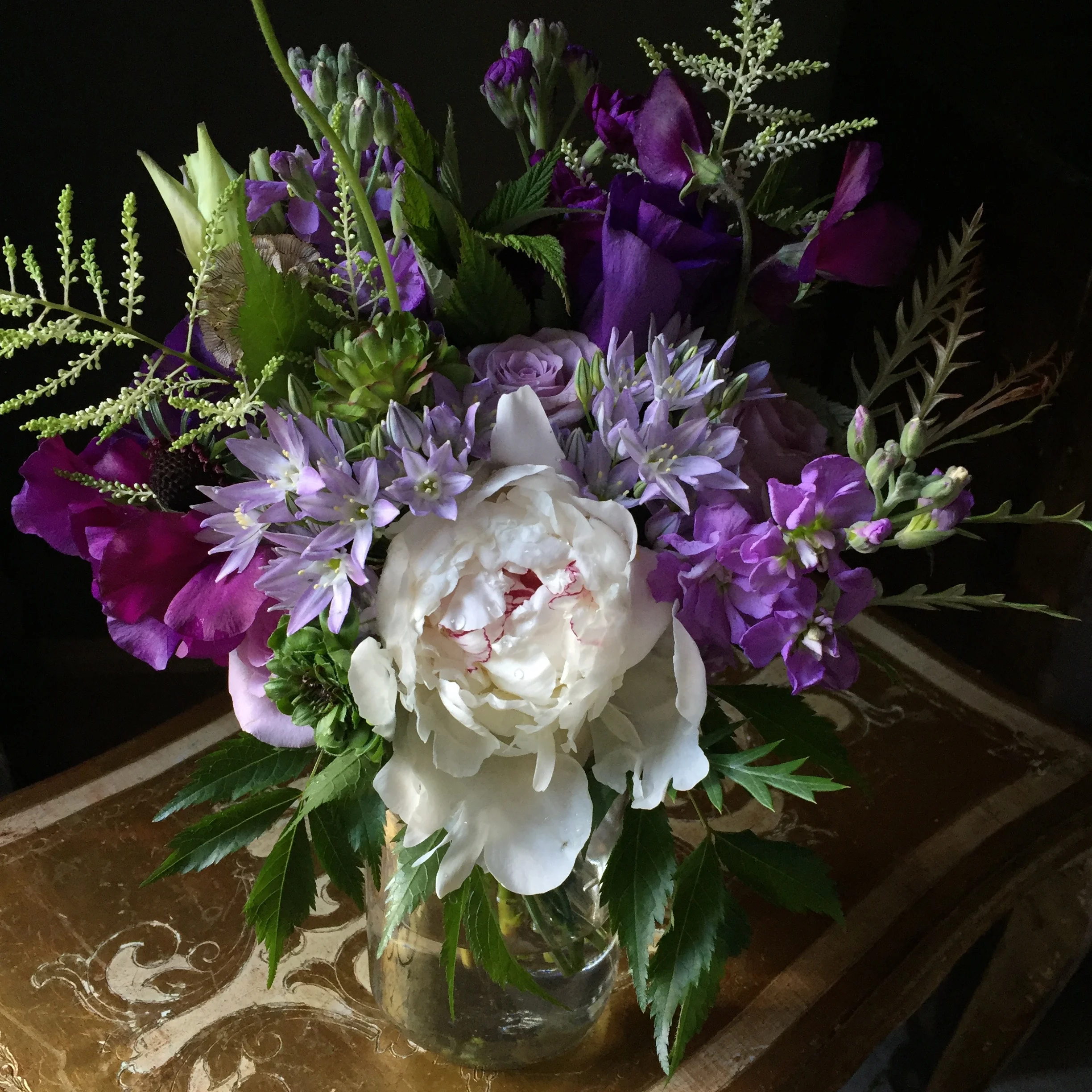 Bridesmaid bouquet in purples, stock, peonies, sweetpeas