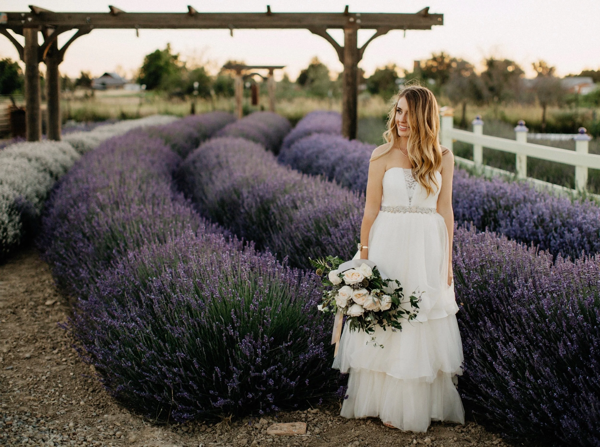 Kelli in lavender field with blush bouquet by Dylan and Sara Photographer