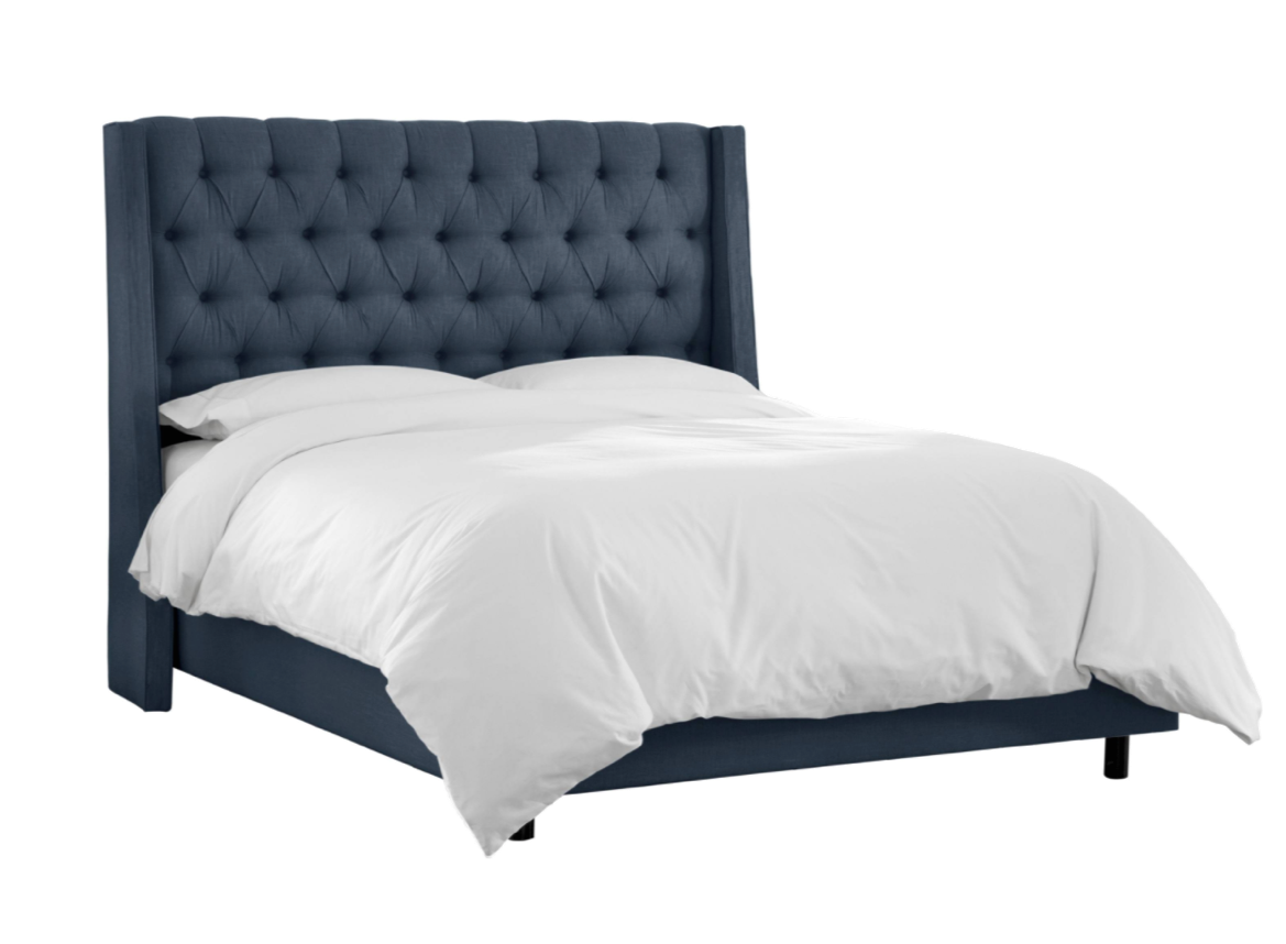 tufted bed in linen ocean