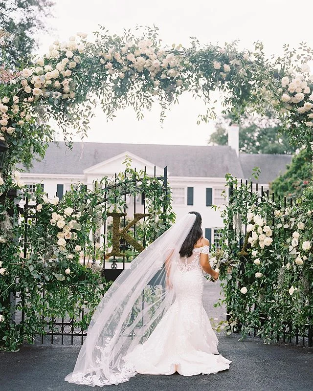 Excited to see Kassandra and Alex’s home wedding featured in @washingtonianweddings! The day was all about honoring family. From the decorated gates that welcomed guests on to the property to pews at the ceremony that were originally located in the same Mississippi church where Alex’s parents were married, it was all about paying homage to family. Which was exactly what they did. Planning + design @karsonbutler | videography @elysiumweddings | tent + flooring @sugarplumtents | floral design + decor @amaryllisinc | caterer @occasionscaterers | lighting @frostlightingdc | photo booth @snapentertainmentmd @brightlyeverafter | hair + make up @hairandmakeupbyclaudine | music @bsquarepro @sagestringquartet @elanartists | Valet: MJ Valet⠀⠀
@mjvalet | rentals @dcrental @whitegloverentals @latavolalinen | childcare @white_house_nannies | live painting @brittanysimart | paper @emilybariddesign | calligraphy @lhcalligraphy | welcome bags⠀⠀
@ahlouisstore, @sugarstudio_co, @emilybairddesign | bride + groom @accordingtokass @alexsenson_14⠀⠀
.⠀⠀
.⠀⠀
.⠀⠀
.⠀⠀
.⠀⠀
#engaged #weddingphotography #weddingday #weddinginspiration #weddingphotographer #realweddings #weddingphotos #weddingideas #weddingwednesday #fineartphotography #filmphotography #wedding #ido #weddingbouquet #bridal #bridetobe #bride #bridalbouquet #weddingday #weddingphoto #weddingideas #bridalstyle #realwedding #weddinginspiration #weddingplanning #bridal #weddings #homewedding #weddingwednesday #bridalportraits ⠀⠀