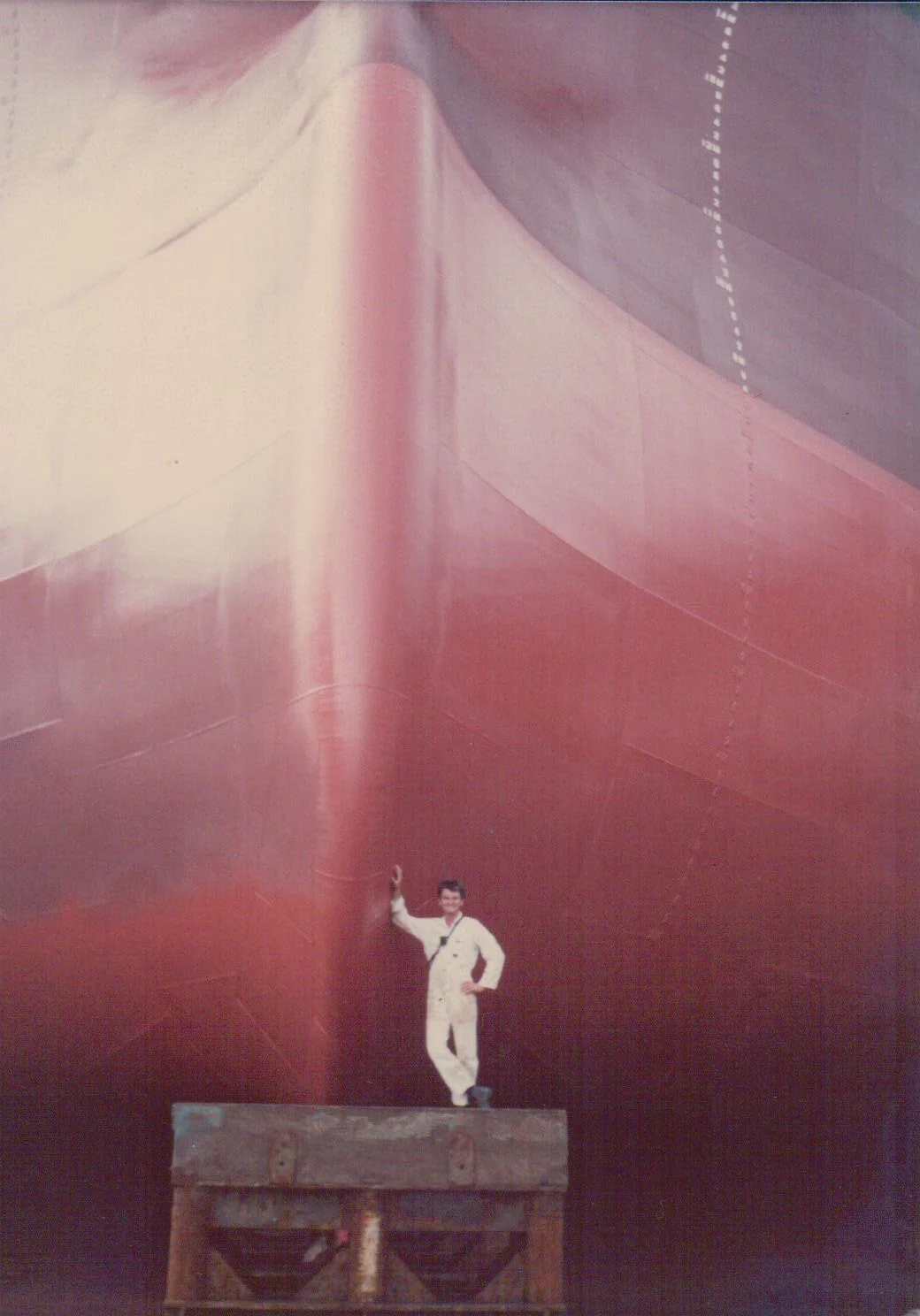Leaning against the  Nivosa 's bulbous bow