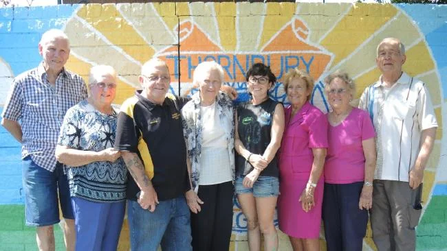 Thornbury Bowls Club Life Members John Scarratt, Jean Chick, Alwyn McCarthy, Marj Walshe, Mary Wilson, Betty Hales, and Ron Wanstall with artist Brenna Quinlan.