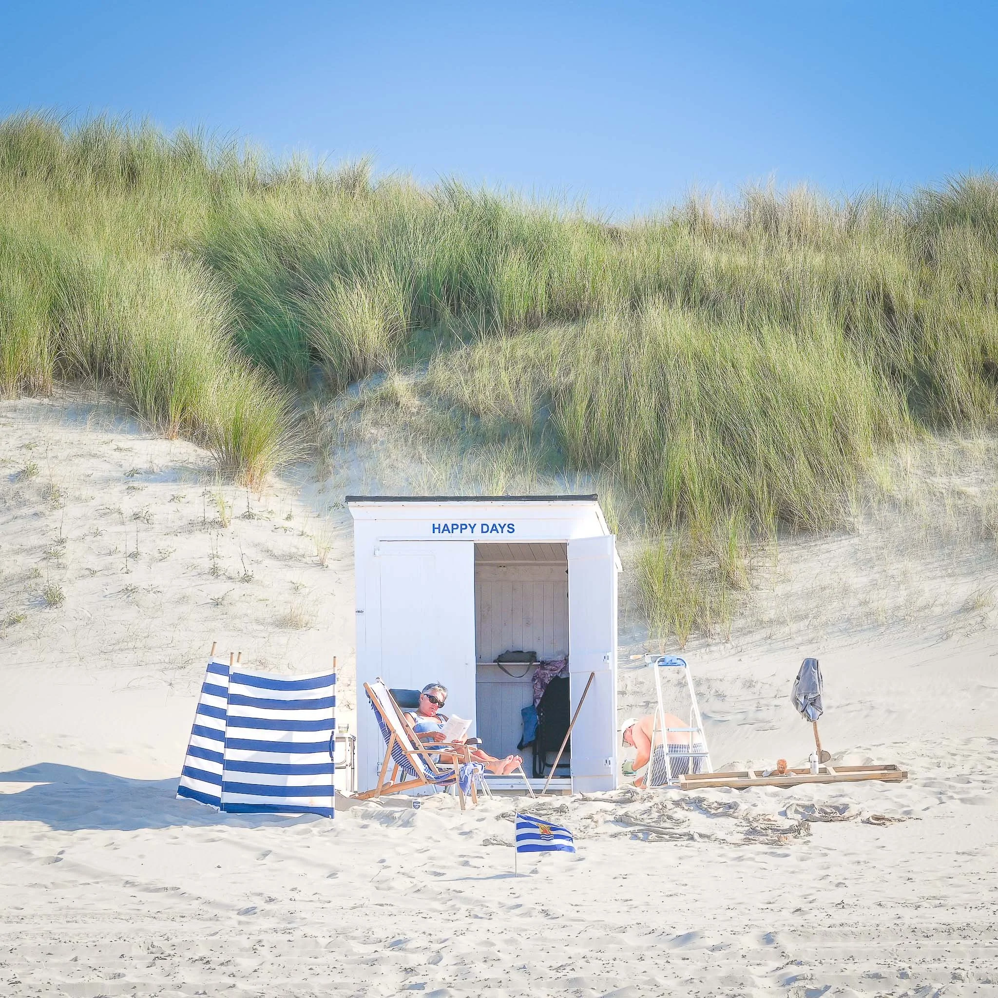  The series  Happy Days  is inspired by the fleeting beauty of everyday places, exploring the beach huts along the Dutch North Sea coast as quiet symbols of memory, refuge and contemplation.  Blurring the boundaries between painting and photography, 