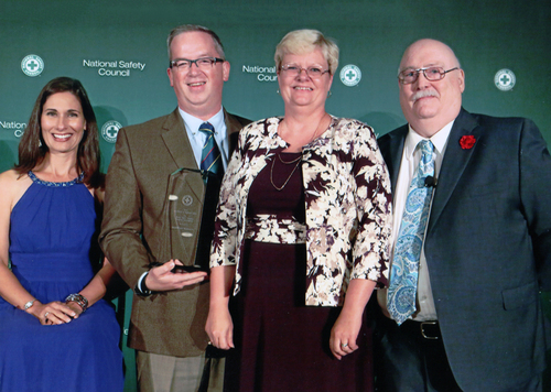 BrainWorks Multimedia President Barry Von Lanken, second from left, and CEO Lisa Von Lanken, third from left, receive the National Safety Council’s 2015 Safety in Excellence in Highway Safety Award for Driving Safety Training Program Innovations from NSC President and CEO Deborah Hersman, left, and James Solomon, right, program development and training director. Photo courtesy BrainWorks Multimedia