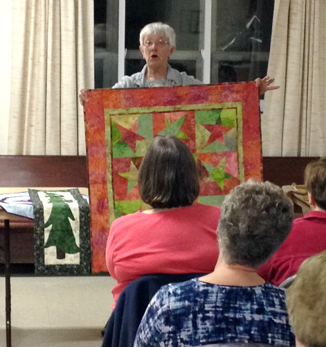 Kitsie Demeree with one of many of her beautiful quilts.